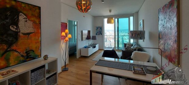 Herrlicher Blick über Wien! - Moderne, komplett eingerichtete 2-Zimmer Wohnung im Triiiple Tower mit großer Terrasse (9m²) wartet! - Photo 1