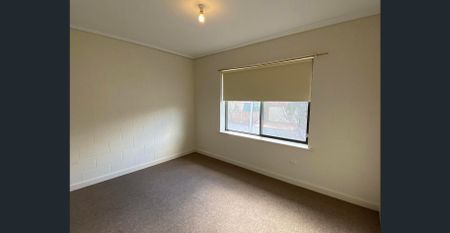 Comfortable and centrally located upstairs unit - Photo 5