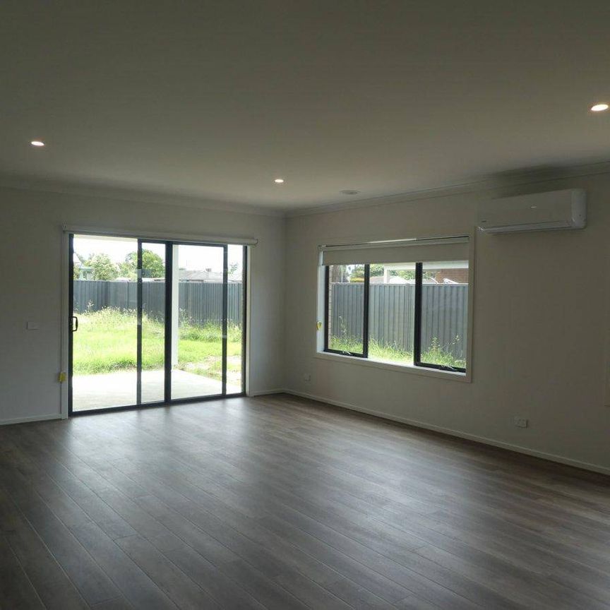 BRAND NEW PROPERTY WITH 2 MASTER SUITES, 2 LOUNGES! - Photo 1