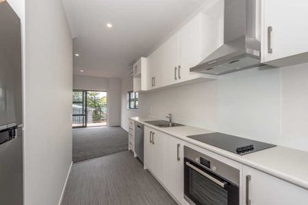 This executive two-bedroom apartment is in a fantastic central location, just a quick 5-minute walk to the CBD, along with nearby restaurants, cafes and a Woolworths supermarket. - Photo 2
