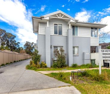 Spacious Three-Bedroom Townhouse in a Great Location! - Photo 1