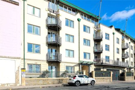 A substantial and open plan, south facing home with a very spacious kitchen / living room, two large double bedrooms, secure off street parking, balcony and wonderful harbour views. - Photo 2