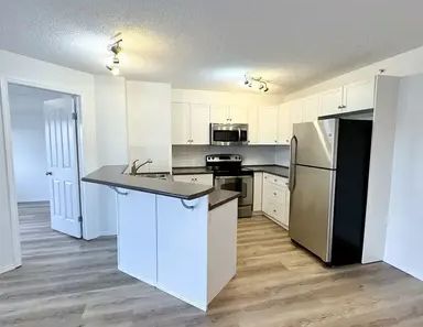 Newly Renovated *High Demand* Top Floor Unit - Avail Feb 1st - | 60 Panatella St NW, Calgary - Photo 1