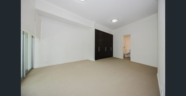 Spacious 2x2 with Huge Balcony & 2 Car Bays - Photo 1