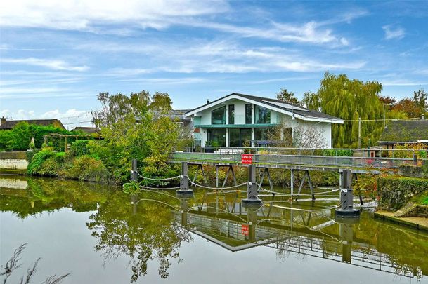 Situated by the water's edge this modern and detached family home boasts exceptional energy efficiency and views of Old Windsor Lock. - Photo 1