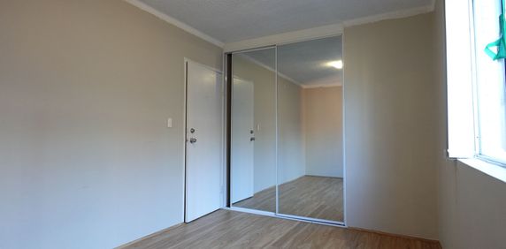 Neat 1st Floor Unit with Train Station across the Road - Photo 2