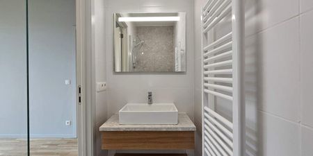 Appartement te huur in Anderlecht voor € 1.100 met 1 slaapkamer - Photo 2