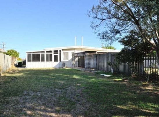 Coastal Comfort & Convenience - Charming Home in Prime Rockingham Location - Photo 1