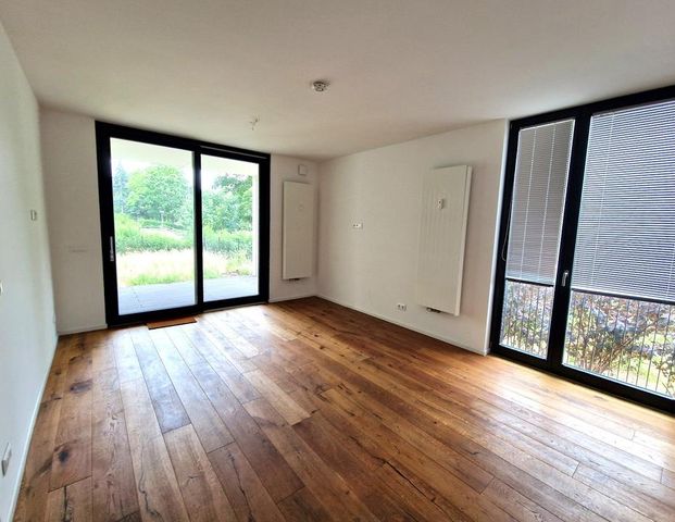 Erdgeschosswohnung im Neubau mit Terrasse, Garten und neuer Einbauküche - 500 € Einzugsgutschein* - Foto 1