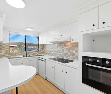 Recently Renovated Three-Bedroom Unit - Photo 1