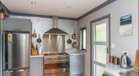 Sunny, Stylish Four-Bedroom Home in Prime Raumati Beach Location - Photo 3