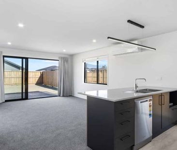 Tidy 4 Bedroom Home with Garage - Photo 4