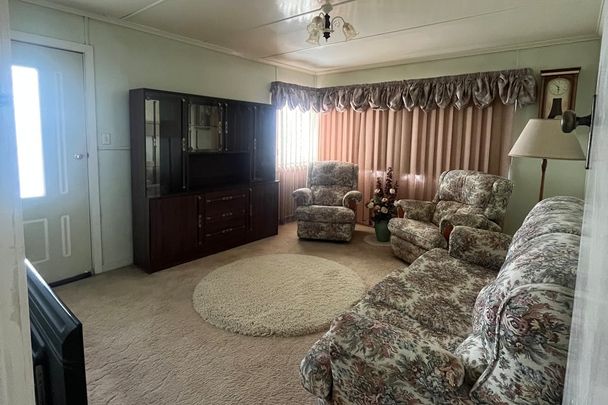 Fully Furnished 3-Bedroom Home with Carport - Photo 1