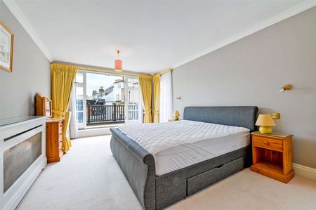 A first floor three bedroom apartment with large wrap around terrace and river views in a secure development with underground parking. - Photo 3