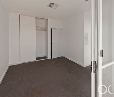 Open the Door to City Serenity with a Private Balcony - Photo 6