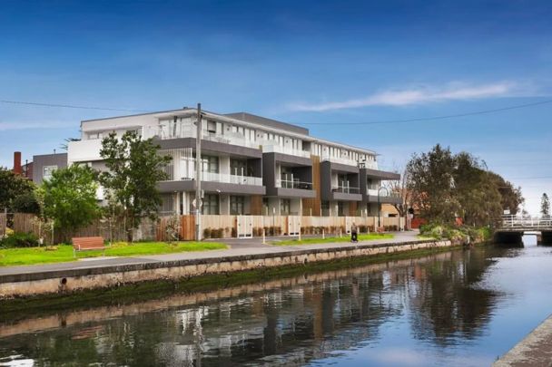 Modern Living with Canal Views & Beachside Lifestyle - Photo 1