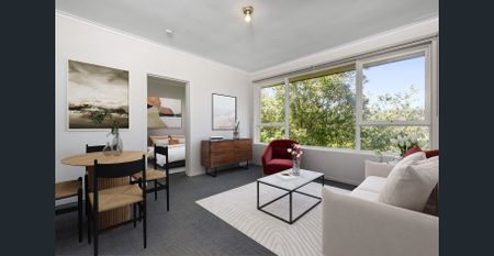 Stylish Two-Bedroom Gem with Secure Parking in a Winning Location! - Photo 3