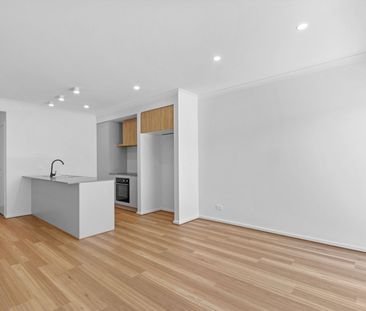 Stylish Two-Level Townhouse with Modern Comfort & Flexibility - Photo 1