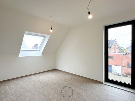 Prachtig gelegen nieuwbouwappartement met drie slaapkamers, groot terras en autostaanplaats - Photo 1