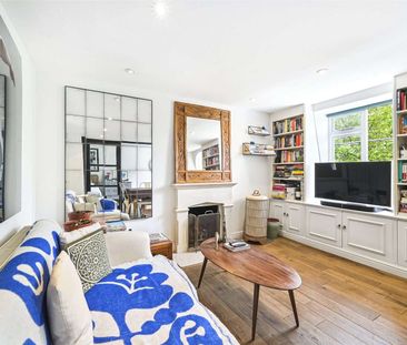 A beautifully presented two bedroom flat with wooden floors through... - Photo 1