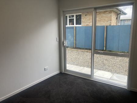 This new, two bedroom home is tucked down a long driveway, surrounded by trees and greenery and offers both a garden shed and a convenient carport. - Photo 3