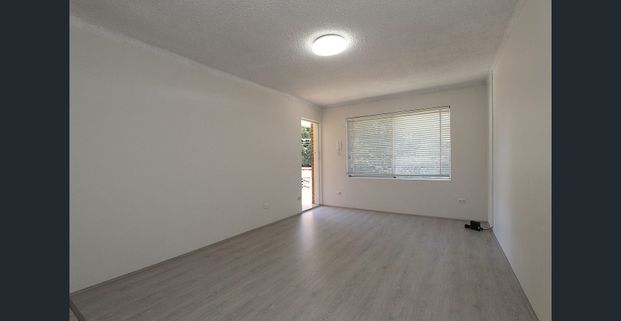 Top Floor Two Bedroom Unit in an Ultra Convenient Location!! - Photo 1