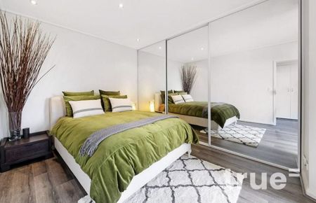 BREATHTAKING WATERSIDE RESIDENCE FEATURING AN EXPANSIVE BALCONY - Photo 3