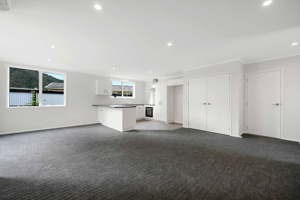 Welcome to your next home – a warm and inviting three-bedroom property that’s super easy to live in. - Photo 1