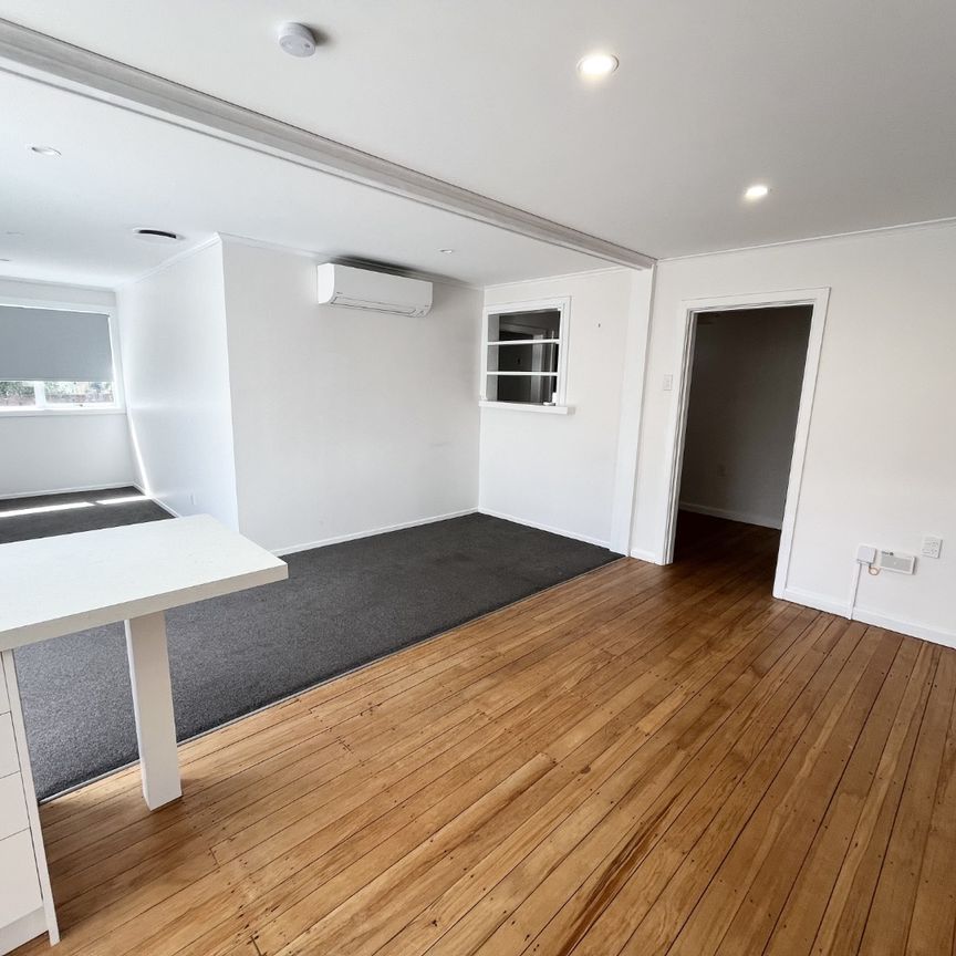 Discover this beautifully renovated three-bedroom, one-bathroom home complete with a second toilet for added convenience. - Photo 1