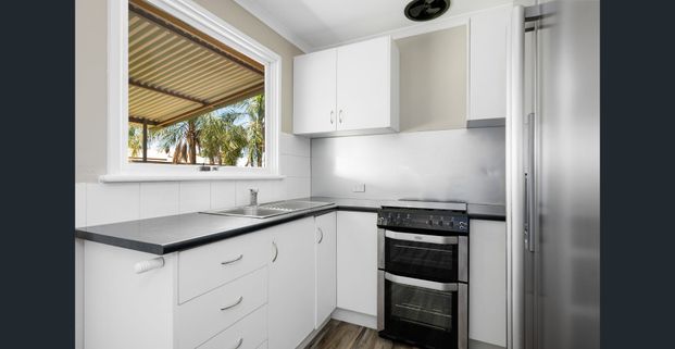 Don't miss this 3x1 well located with a large Backyard. - Photo 1