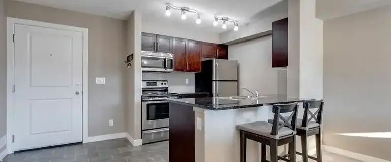 TOP FLOOR LEGACY CONDO WITH UNDERGROUND PARKING AND LOCKER | Calgary - Photo 1