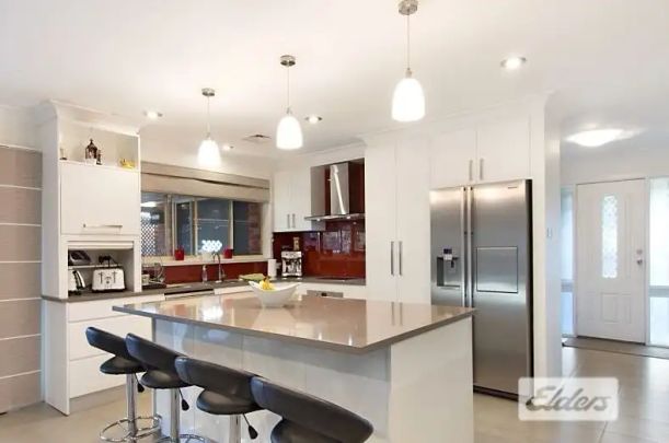 “4 BEDROOMS FAMILY HOME, WALKING DISTANCE TO QUAKERS HILL SHOPS & STATION” - Photo 1