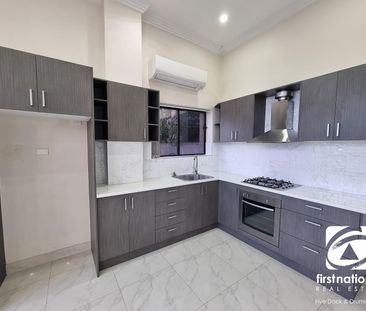 RENOVATED 1 BEDROOM FLAT WITH LARGE YARD AND WATER GLIMPSE - Photo 5