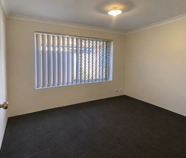 Neat 4-Bedroom Home with Monthly Lawn Mowing Included - Photo 3