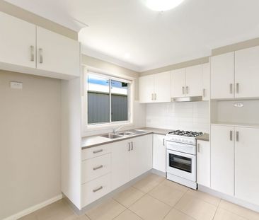 Modern Two-Bedroom Home with Lawn-Maintenance Included - Photo 3