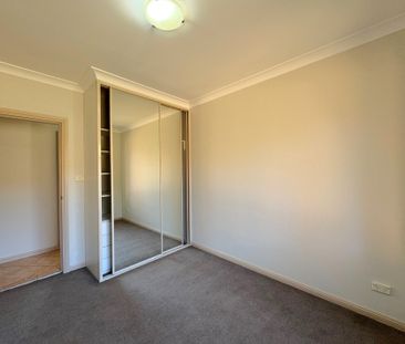 Spacious 3 Bedroom Full Brick Villa - Photo 1