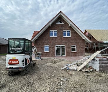 Neubauwohnung im Erdgeschoss mit großer Garage und Garten - Foto 1