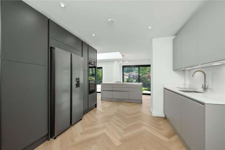 An exceptional four bedroom home offering generous living space, a private driveway and a beautifully established rear garden, positioned within a sought-after residential setting. - Photo 5