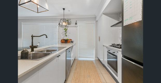 Who doesn't love a white picket fence! Four Bedroom, Three Living and Solar ! - Photo 1