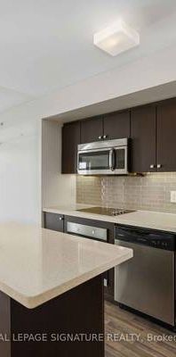 Station Condos! Sparkling clean 1 Bed + Den. European Style Kitchen - Photo 1