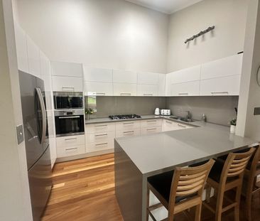 Modern Family Home with Stunning Outlook - Photo 6