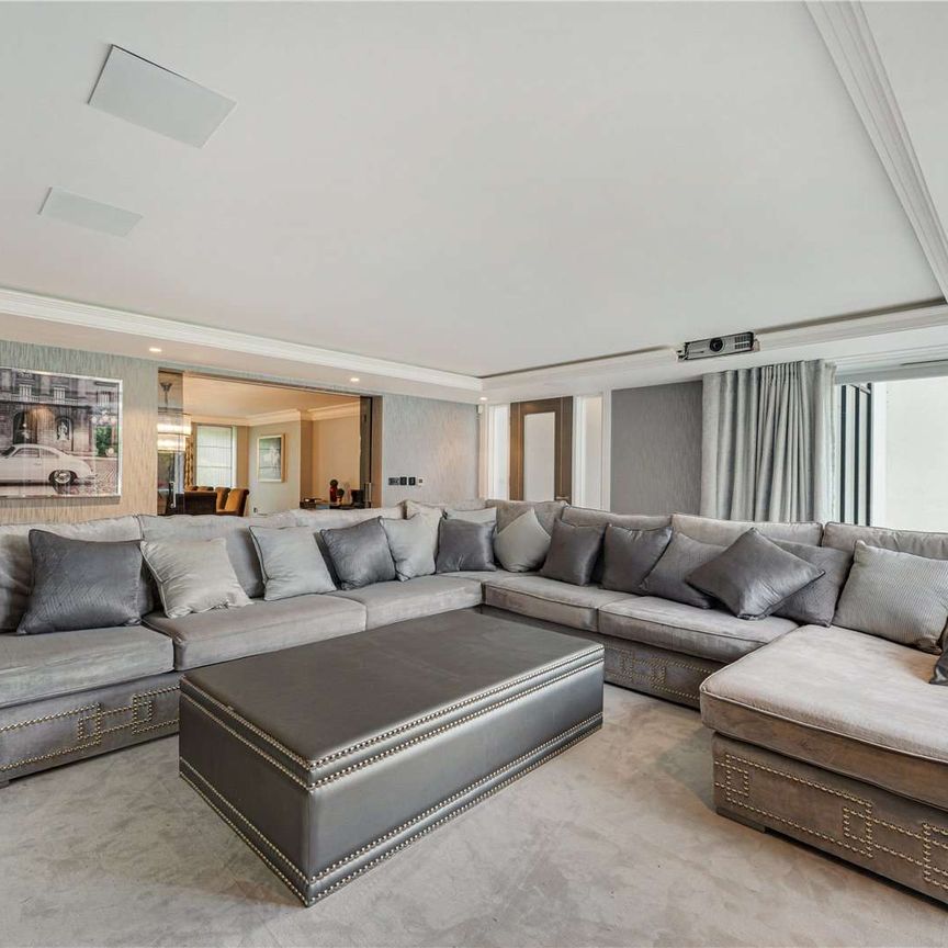 An exceptional contemporary home of over 5,000 sq ft, set behind electric gates on one of Hale Barns' most prestigious roads. - Photo 1