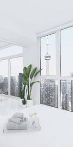 Sleek 1 Bed, 1 Bath with City Views and Office Den - Photo 3