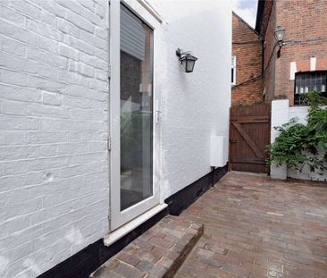 Charming two bedroom cottage with a courtyard garden located in the... - Photo 3