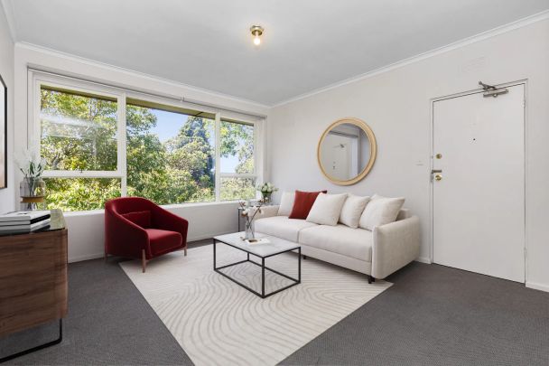 Stylish Two-Bedroom Gem with Secure Parking in a Winning Location! - Photo 1