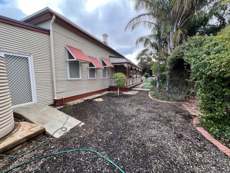 Across from the Hospital - Furnished - Photo 2