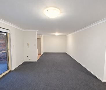 Spacious Two-Bedroom Apartment with Balcony & Two Car Spaces - Photo 1