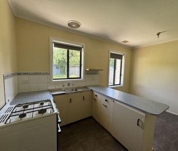 Neat Three-Bedroom Home in Prime Location - Photo 2