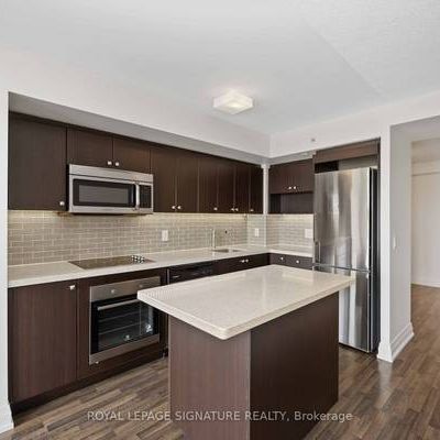 Station Condos! Sparkling clean 1 Bed + Den. European Style Kitchen - Photo 3