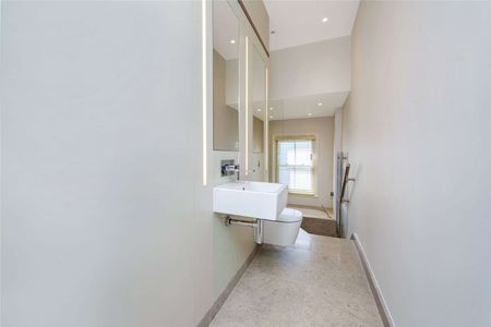 A modern 2 bedroom, 1 bathroom duplex on the third and fourth floors. - Photo 2